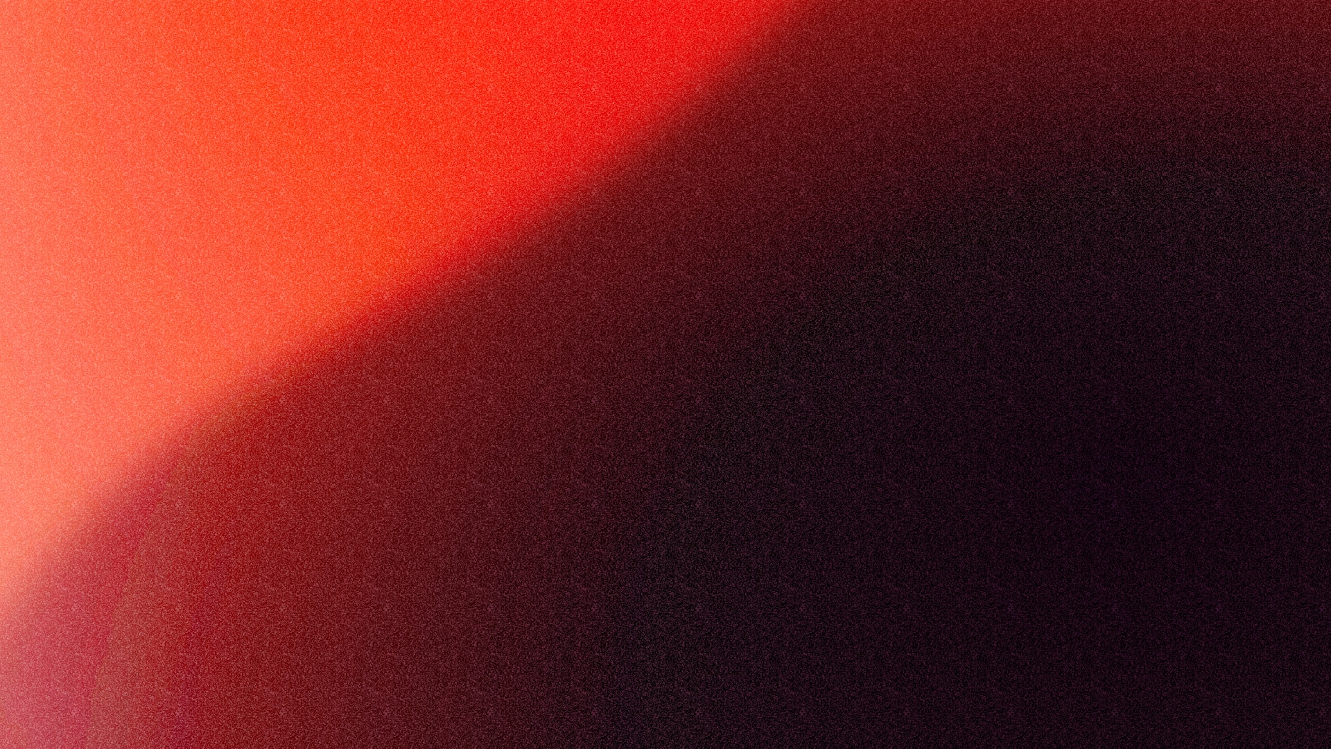 a blurry image of a red and black background
